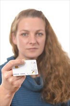 Woman holding a health insurance card