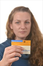 Woman holding an organ donor card