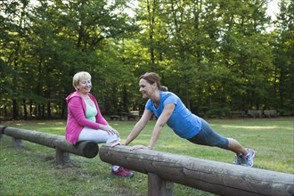 Women exercising on an outdoor fitness trail