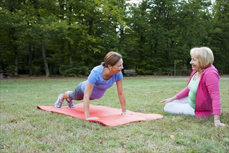 Women doing gymnastics outdoors