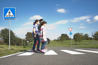 Children crossing a zebra crossing