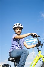 Girl wearing a bike helmet at a traffic awareness course
