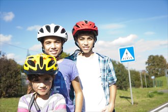 Children wearing bike helmets at a traffic awareness course