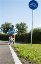 Child riding a bicycle at a traffic awareness course