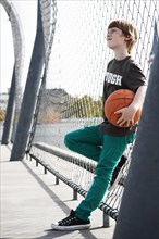 Cool boy holding a basketball