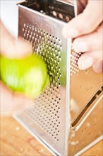 Grating lime peel with a grater