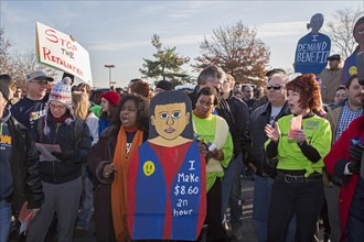 Walmart workers rally with supporters outside one of the company's stores on Black Friday