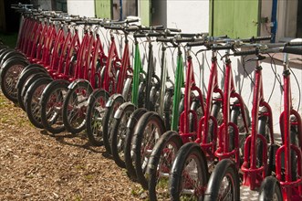 A row of downhill scooters
