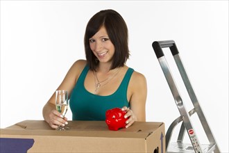 Young woman with a moving box