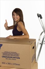 Young woman with moving boxes