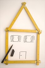Folding rule in the shape of a house