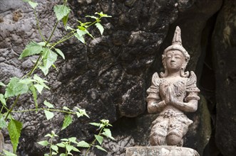 Statue or sculpture in front of the Buddha Cave