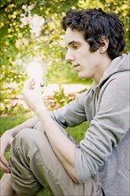 Young man sitting in nature