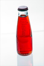 Red drink in a bottle