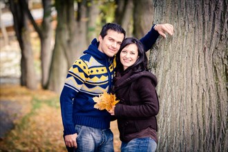 Young couple in a park in autumn