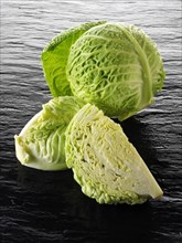 Whole and cut Savoy cabbage