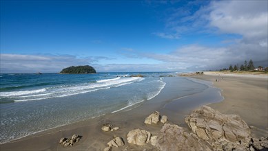 Sandy beach beach of Mount Manganui with peninsula Moturiki and island Motiti Island