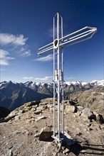 Summit cross on Orgelspitz or Laaser Spitz Mountain above Laas