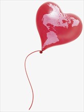 Heart-shaped balloon with a map of North America and South America