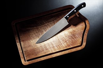 Kitchen knife on a cutting board