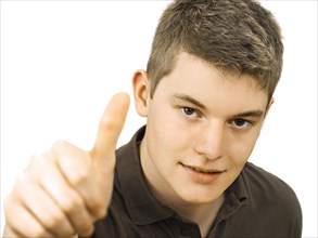 Teenager making a thumbs up gesture