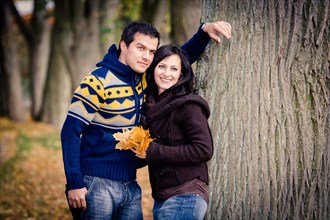 Young couple in a park in autumn