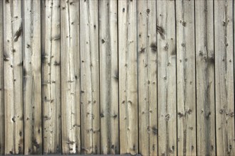 Faded wooden wall of planed boards