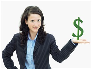 Young businesswoman holding a dollar sign