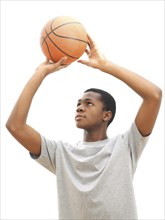 Young male playing basketball