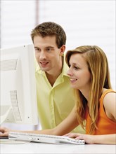 Young couple using a computer