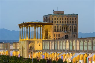 Illuminated Ali Qapu palace at dusk