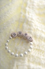 Newborn bracelet with the word Baby