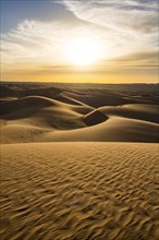 Sunset in the giant sanddunes of the Sahara
