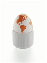 Egg as a globe with North America and South America