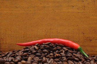 Red pepper on coffee beans