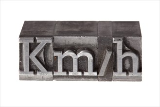 Old lead letters forming the acronym 'kmh' for kilometres per hour