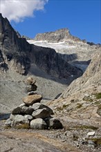 Cairn in Baechlital valley in front of Gross Diamentstock Mountain and Baechli Glacier