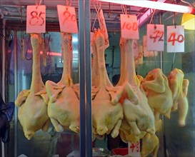 Fresh chicken of a butcher in a market