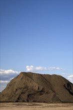 Mound of topsoil in a commercial sandpit