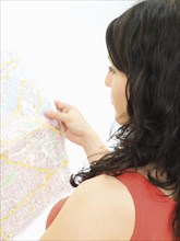 Young woman looking at a city map