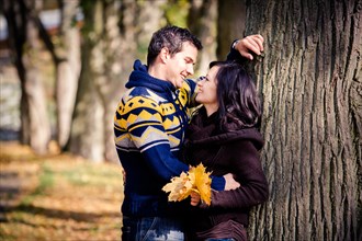 Young couple in a park in autumn