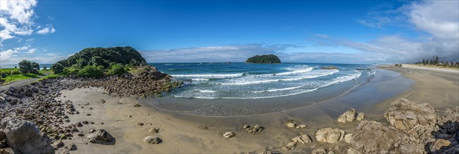 Sandy beach beach of Mount Manganui with peninsula Moturiki and island Motiti Island