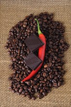 Red pepper and chocolate on coffee beans