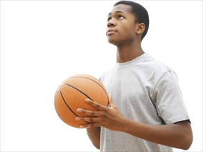 Young male playing basketball