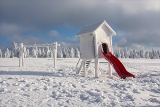 Snow-covered playground in winter on the Fichtelberg mountain