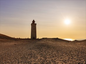 Lighthouse on the moving dune Rubjerg Knude at sunset