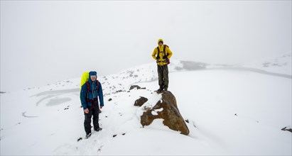 Hikers at Emerald Lake Lookout in Snow
