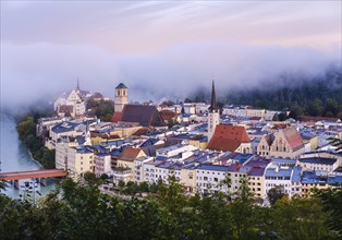 Old town at dawn and fog