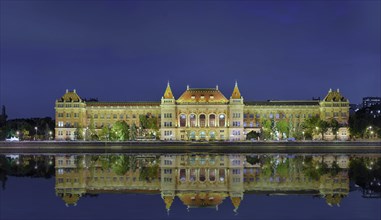 University with reflection in the Danube