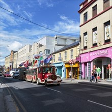 Tourist train runs through downtown Galway